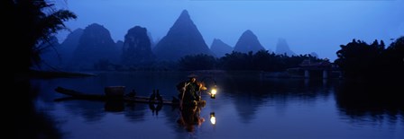 Fisherman fishing at night, Li River , China by Panoramic Images art print
