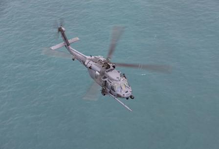 An HH-60G Pave Hawk Along the coastline of Okinawa, Japan (from above) by HIGH-G Productions/Stocktrek Images art print