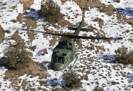 UH-1N Twin Huey over Kirtland Air Force Base, New Mexico by HIGH-G Productions/Stocktrek Images art print