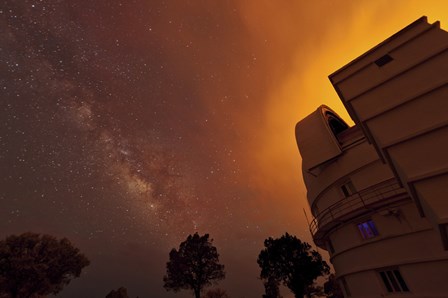 Milky Way Appears through Smoke over the McDonald Observatory by John Davis/Stocktrek Images art print