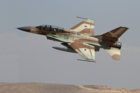 An F-16B Netz of the Israeli Air Force in flight over Israel by Ofer Zidon/Stocktrek Images art print