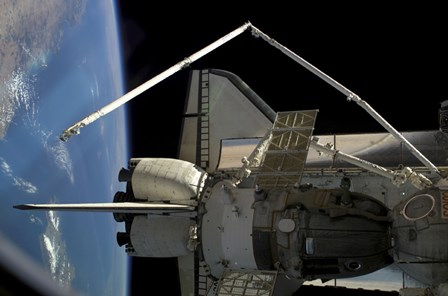 A Soyuz Vehicle and the Space Shuttle Discovery Docked to the International Space Station by Stocktrek Images art print